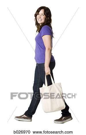 woman carrying a bag View Large Photo Image Stock Image - woman carrying a bag. Fotosearch