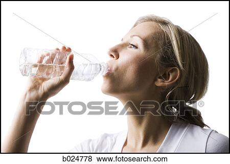 woman drinking a bottled water View Large Photo Image Stock Photo - woman drinking a bottled water. Fotosearch