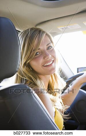 Stock Image - woman driving a car. Fotosearch