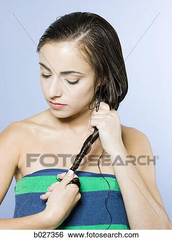 woman drying hair after a bath View Large Photo Image Stock Photograph - woman drying hair after a bath. Fotosearch