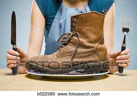 woman eating a boot View Large Photo Image Stock Photo - woman eating a boot. Fotosearch
