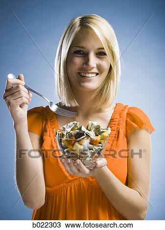 woman eating a salad made of money View Large Photo Image Stock Image - woman eating a salad made of money. Fotosearch