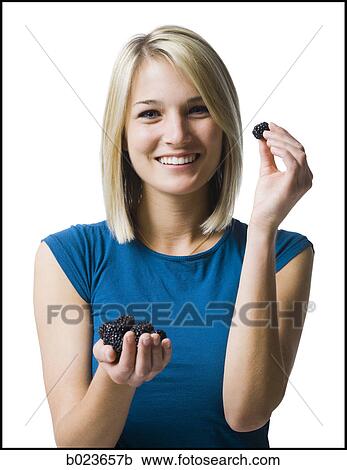 woman eating blackberries View Large Photo Image Stock Image - woman eating blackberries. Fotosearch