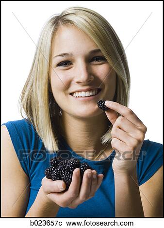 woman eating blackberries View Large Photo Image Stock Image - woman eating blackberries. Fotosearch