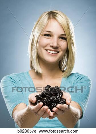 woman eating blackberries View Large Photo Image Stock Image - woman eating blackberries. Fotosearch