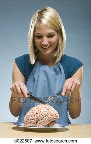 woman eating "brain food" View Large Photo Image Stock Photo - woman eating "brain food". Fotosearch