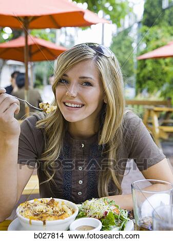 woman eating lunch View Large Photo Image Picture - woman eating lunch. Fotosearch