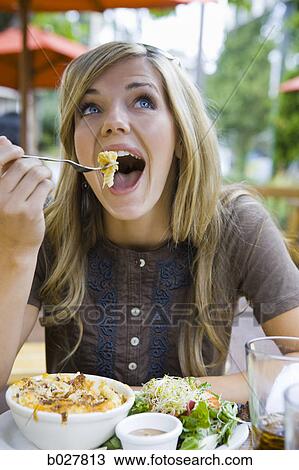 woman eating lunch View Large Photo Image Stock Image - woman eating lunch. Fotosearch