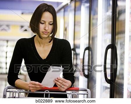 Stock Photo - woman grocery shopping. Fotosearch