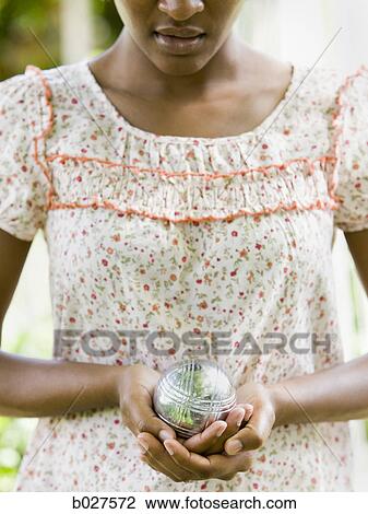 woman holding a ball View Large Photo Image Stock Image - woman holding a ball. Fotosearch