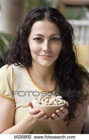 woman holding a bowl of nuts View Large Photo Image Stock Image - woman holding a bowl of nuts. Fotosearch