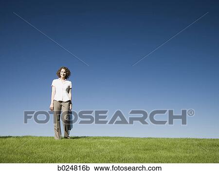 Stock Image - woman holding a briefcase. Fotosearch