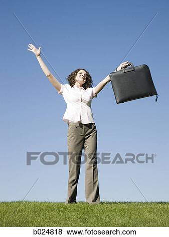 Stock Photo - woman holding a briefcase. Fotosearch