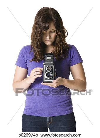 woman holding a camera View Large Photo Image Stock Image - woman holding a camera. Fotosearch