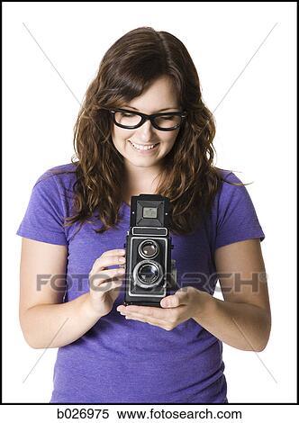 woman holding a camera View Large Photo Image Stock Photography - woman holding a camera. Fotosearch