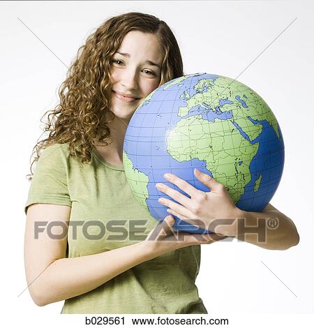 woman holding a globe View Large Photo Image Stock Image - woman holding a globe. Fotosearch