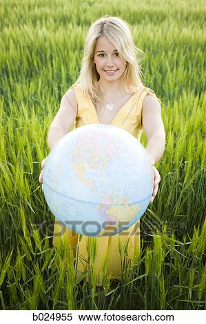 woman holding a globe View Large Photo Image Stock Photography - woman holding a globe. Fotosearch