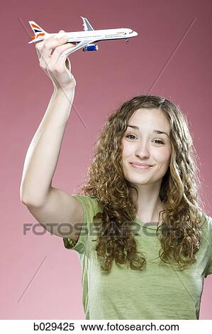 woman holding a model airplane View Large Photo Image Stock Photography - woman holding a model airplane. Fotosearch