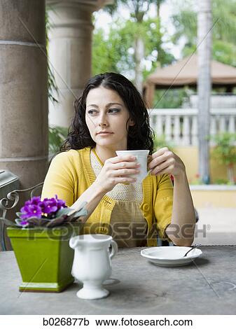 Stock Image - woman holding a mug. Fotosearch