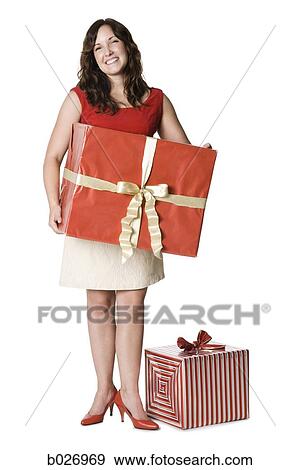 woman holding a present View Large Photo Image Stock Photo - woman holding a present. Fotosearch