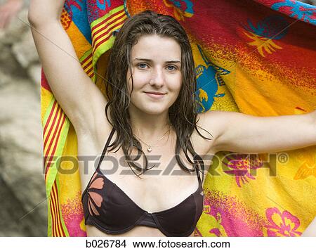 woman holding a towel View Large Photo Image Picture - woman holding a towel. Fotosearch