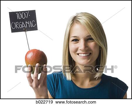 woman holding an organic mango View Large Photo Image Stock Photo - woman holding an organic mango. Fotosearch