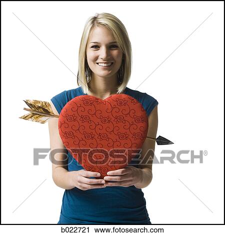 woman holding an oversized red heart View Large Photo Image Stock Image - woman holding an oversized red heart. Fotosearch