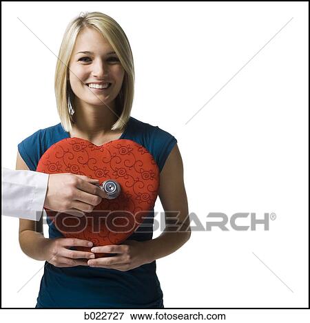woman holding an oversized red heart View Large Photo Image Stock Photo - woman holding an oversized red heart. Fotosearch