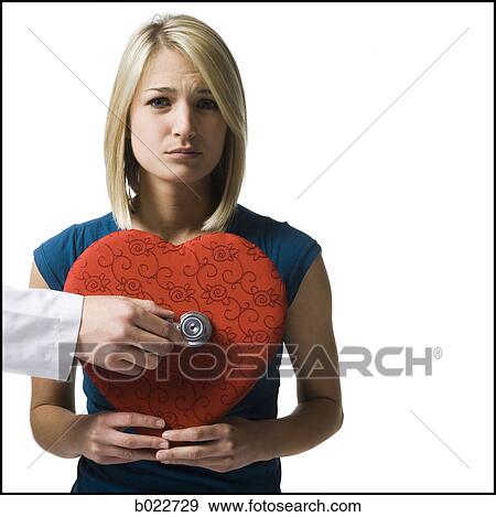 woman holding an oversized red heart View Large Photo Image Stock Photo - woman holding an oversized red heart. Fotosearch