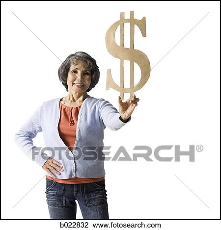 Stock Image - woman holding currency symbol. Fotosearch