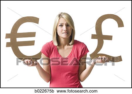 Stock Image - woman holding currency symbols. Fotosearch