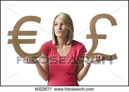 Stock Photo - woman holding currency symbols. Fotosearch