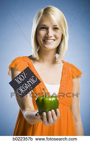 woman holding organic produce View Large Photo Image Stock Image - woman holding organic produce. Fotosearch