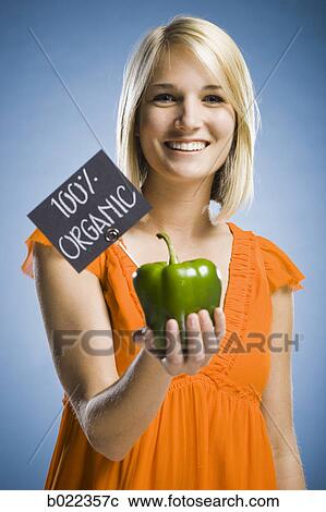 woman holding organic produce View Large Photo Image Stock Image - woman holding organic produce. Fotosearch