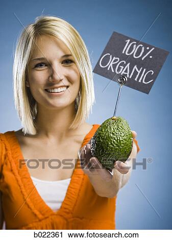 woman holding organic produce View Large Photo Image Stock Image - woman holding organic produce. Fotosearch