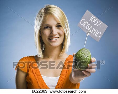 woman holding organic produce View Large Photo Image Stock Image - woman holding organic produce. Fotosearch