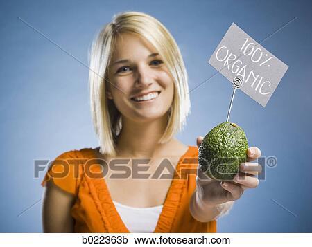 woman holding organic produce View Large Photo Image Stock Image - woman holding organic produce. Fotosearch