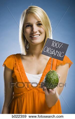woman holding organic produce View Large Photo Image Stock Photo - woman holding organic produce. Fotosearch