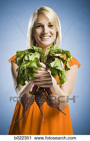 woman holding radishes View Large Photo Image Stock Image - woman holding radishes. Fotosearch