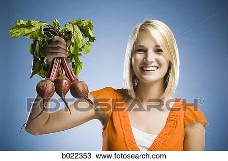 woman holding radishes View Large Photo Image Stock Image - woman holding radishes. Fotosearch