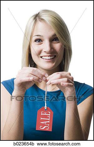 woman holding sale tag View Large Photo Image Stock Image - woman holding sale tag. Fotosearch