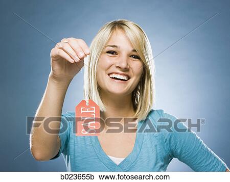 woman holding sale tag View Large Photo Image Stock Image - woman holding sale tag. Fotosearch