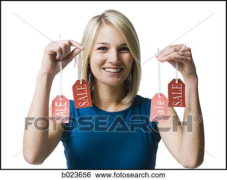 woman holding sale tags View Large Photo Image Stock Photograph - woman holding sale tags. Fotosearch