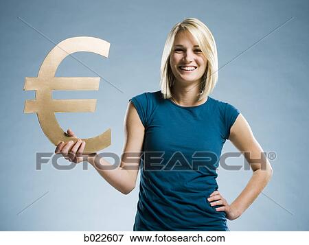woman holding up a euro symbol View Large Photo Image Stock Photo - woman holding up a euro symbol. Fotosearch