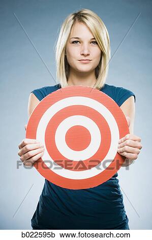 woman holding up a target View Large Photo Image Stock Image - woman holding up a target. Fotosearch