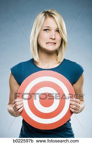woman holding up a target View Large Photo Image Stock Image - woman holding up a target. Fotosearch