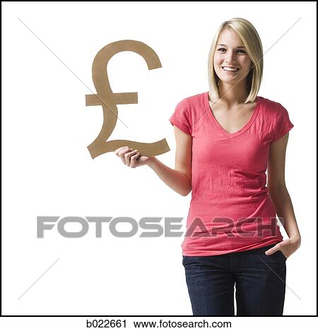 woman holding up british pound symbol View Large Photo Image Stock Image - woman holding up british pound symbol. Fotosearch