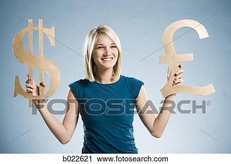woman holding up currency symbols View Large Photo Image Stock Image - woman holding up currency symbols. Fotosearch