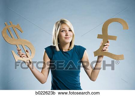 woman holding up currency symbols View Large Photo Image Stock Image - woman holding up currency symbols. Fotosearch