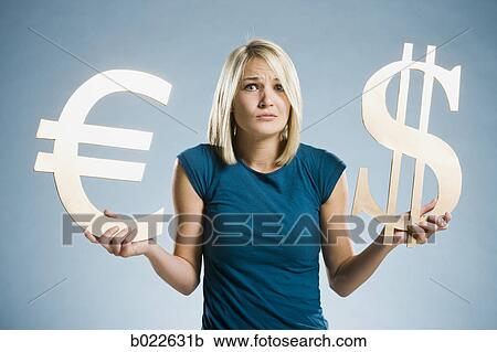 woman holding up currency symbols View Large Photo Image Stock Image - woman holding up currency symbols. Fotosearch